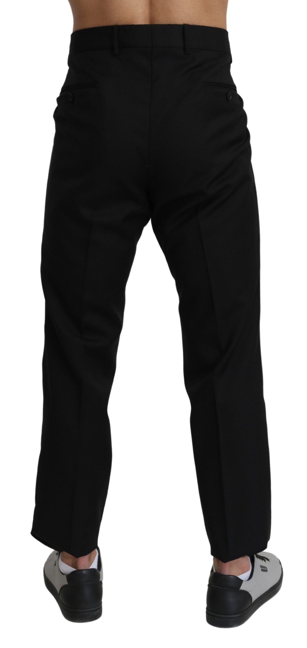 Black cotton wool formal dress pants by Dolce & Gabbana, tailored fit with classic design and belt loops on a white background.