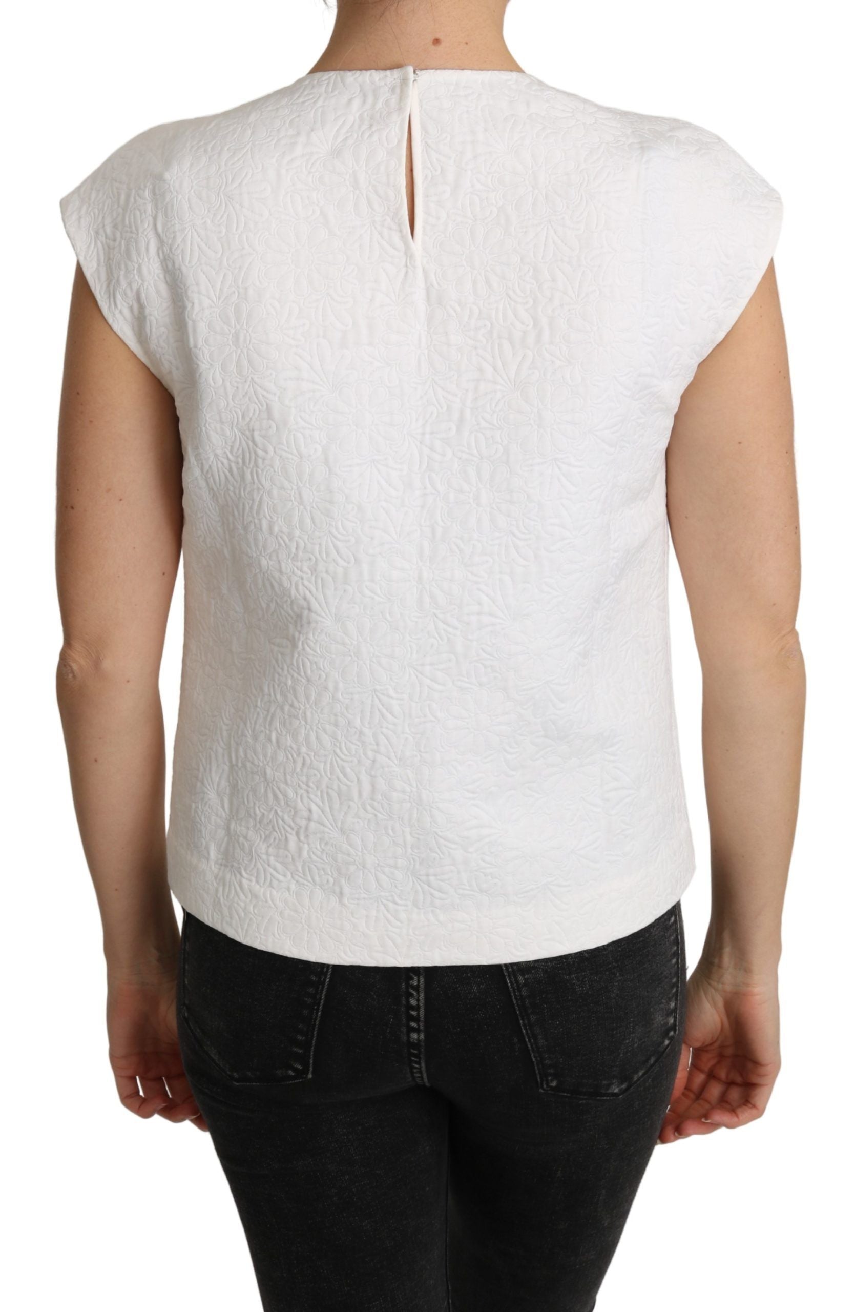 White floral brocade blouse made of cotton by Dolce & Gabbana, featuring intricate floral patterns and a classic, elegant design.