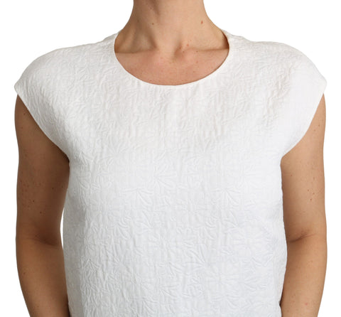 White floral brocade blouse made of cotton by Dolce & Gabbana, featuring intricate floral patterns and a stylish neckline.
