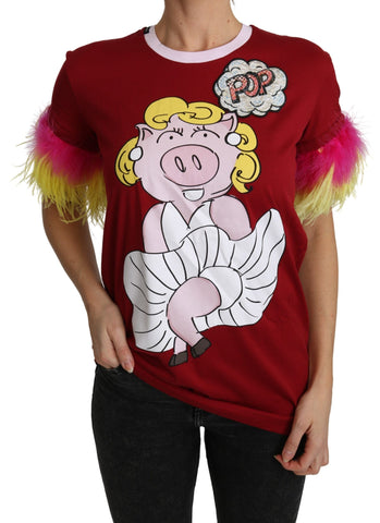Red T-shirt top with pig print and feather sleeves by Dolce & Gabbana, featuring a bold, artistic design.