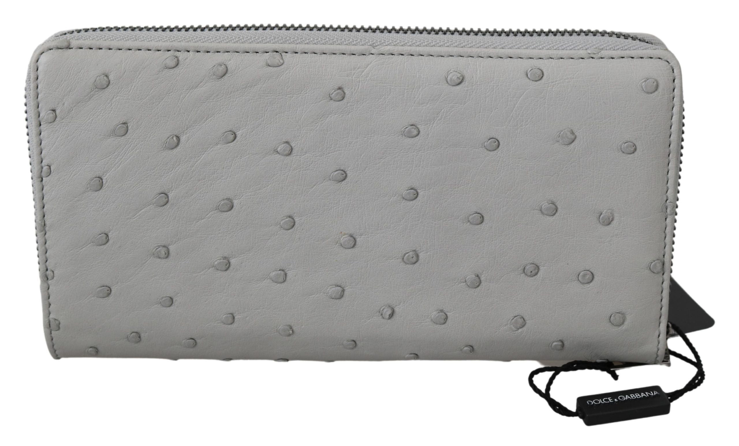 White ostrich leather men's clutch wallet with continental design by Dolce & Gabbana, featuring multiple card slots and a sleek finish.