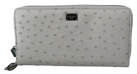 White Dolce & Gabbana ostrich leather continental men's clutch wallet with sleek design and textured finish.