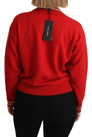Red knitted cashmere cartoon top sweater by Dolce & Gabbana, featuring playful cartoon designs and a cozy, stylish fit.