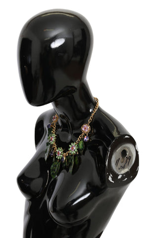 Gold brass flower pendant necklace with green leaves and crystal accents from Dolce & Gabbana, featuring a detailed floral design.