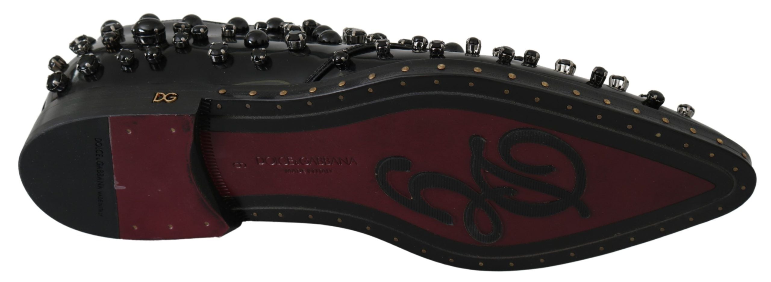 Black leather brogue shoes with crystal embellishments by Dolce & Gabbana, featuring classic lace-up design and detailed stitching.