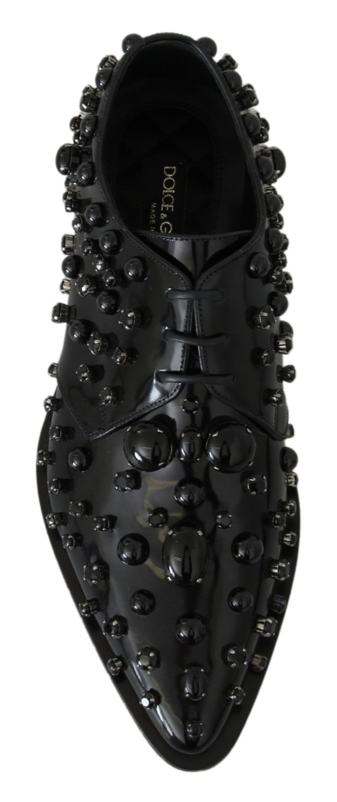 Black leather brogue shoes with crystal embellishments by Dolce & Gabbana, featuring classic design and detailed stitching.