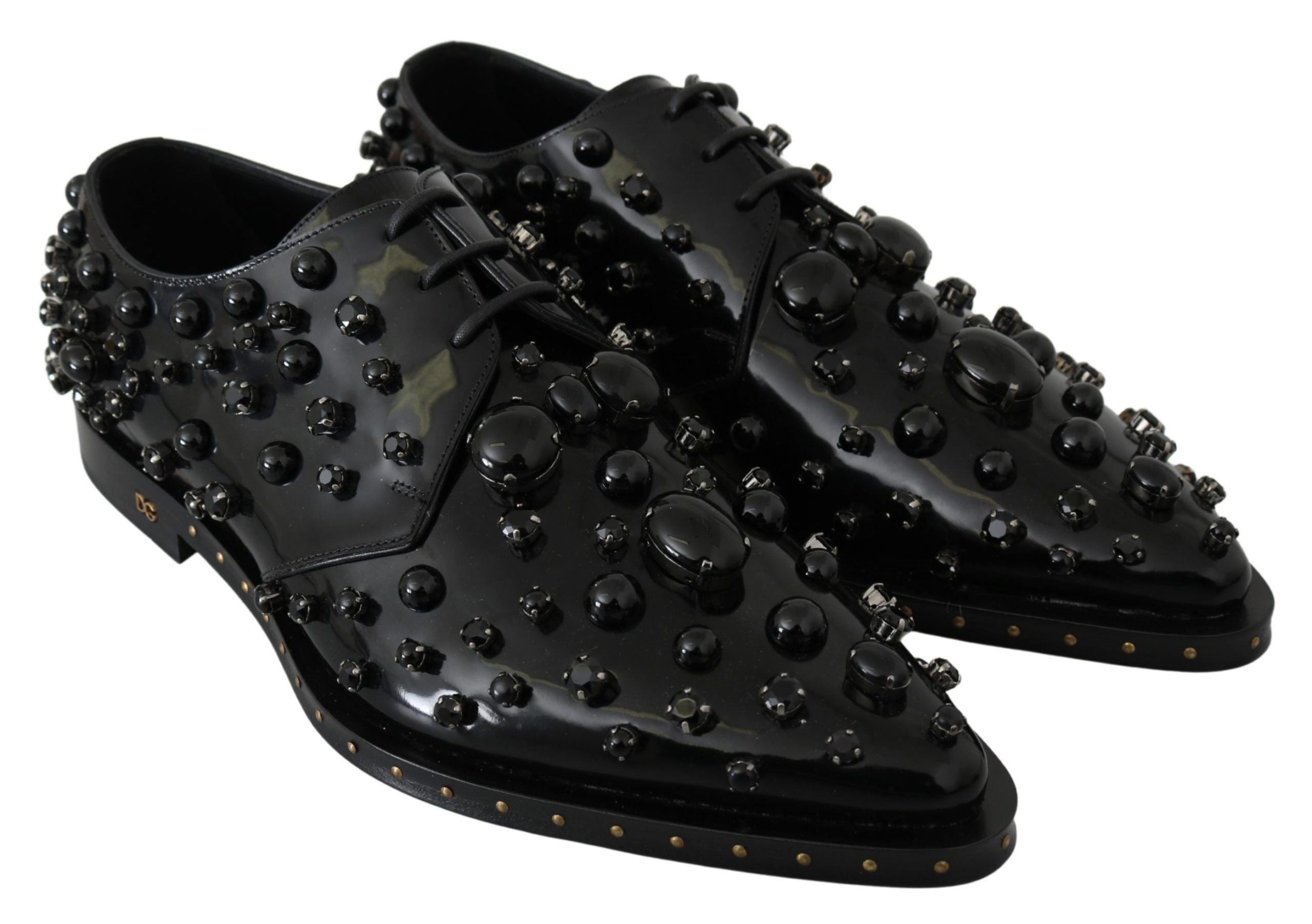 Black leather brogue shoes with crystal embellishments from Dolce & Gabbana, featuring detailed stitching and classic design.