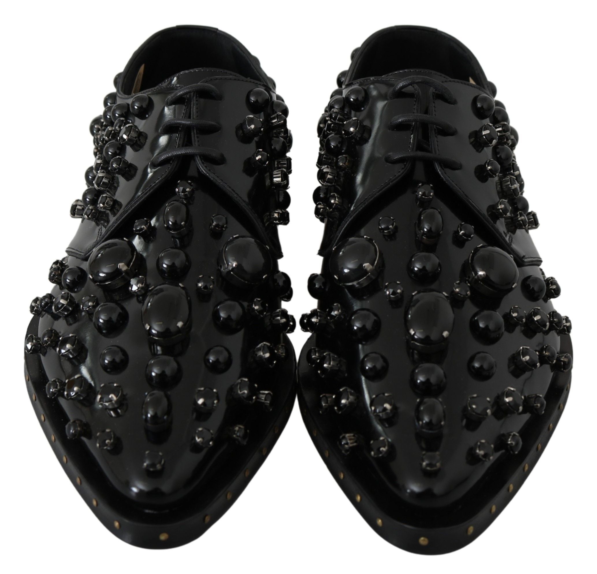 Black leather brogue shoes with crystal accents from Dolce & Gabbana, featuring a classic lace-up design and polished finish.