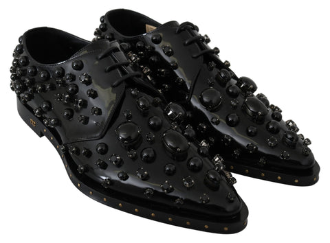 Black leather brogue shoes with crystal embellishments from Dolce & Gabbana, featuring a classic lace-up design and polished finish.