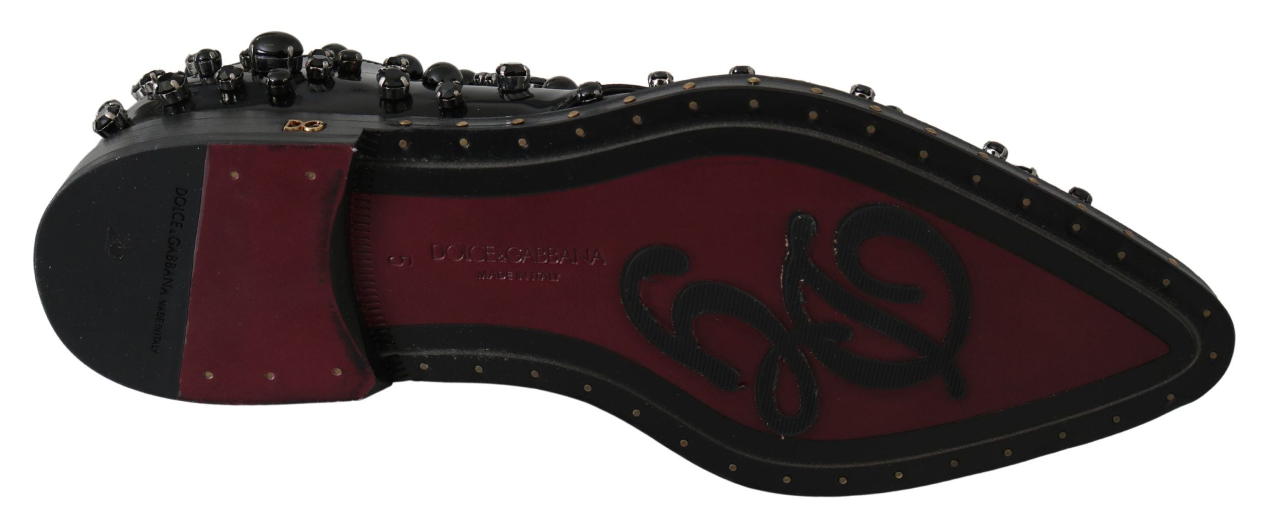 Black leather brogue shoes with crystal embellishments by Dolce & Gabbana, featuring a classic lace-up design and polished finish.