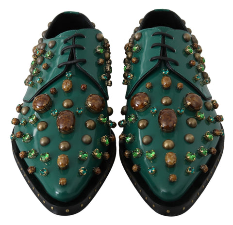 Green leather crystal-embellished brogue shoes by Dolce & Gabbana with detailed stitching and classic wingtip design.