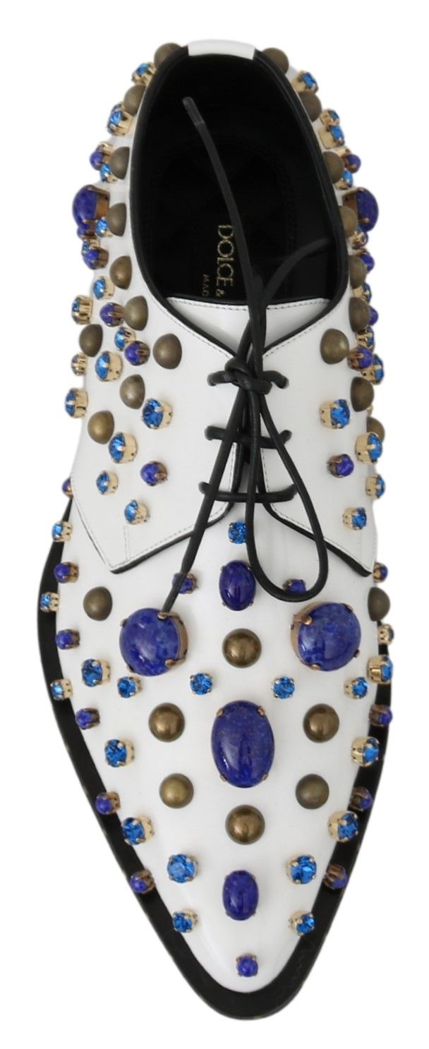 White leather brogue shoes with crystal embellishments from Dolce & Gabbana, featuring detailed stitching and classic design.