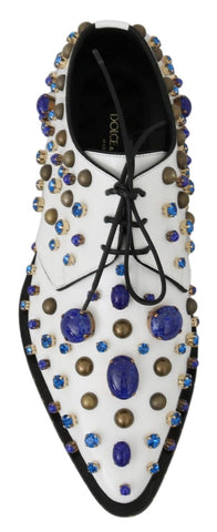 White leather brogue shoes with crystal embellishments from Dolce & Gabbana, featuring detailed stitching and classic design.