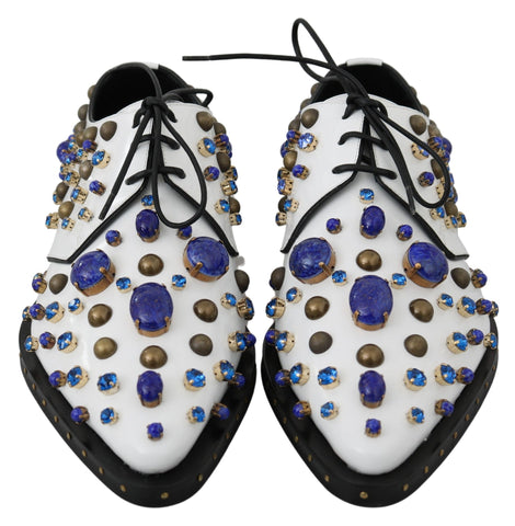 White leather brogue shoes with crystal embellishments by Dolce & Gabbana, featuring detailed stitching and classic design.