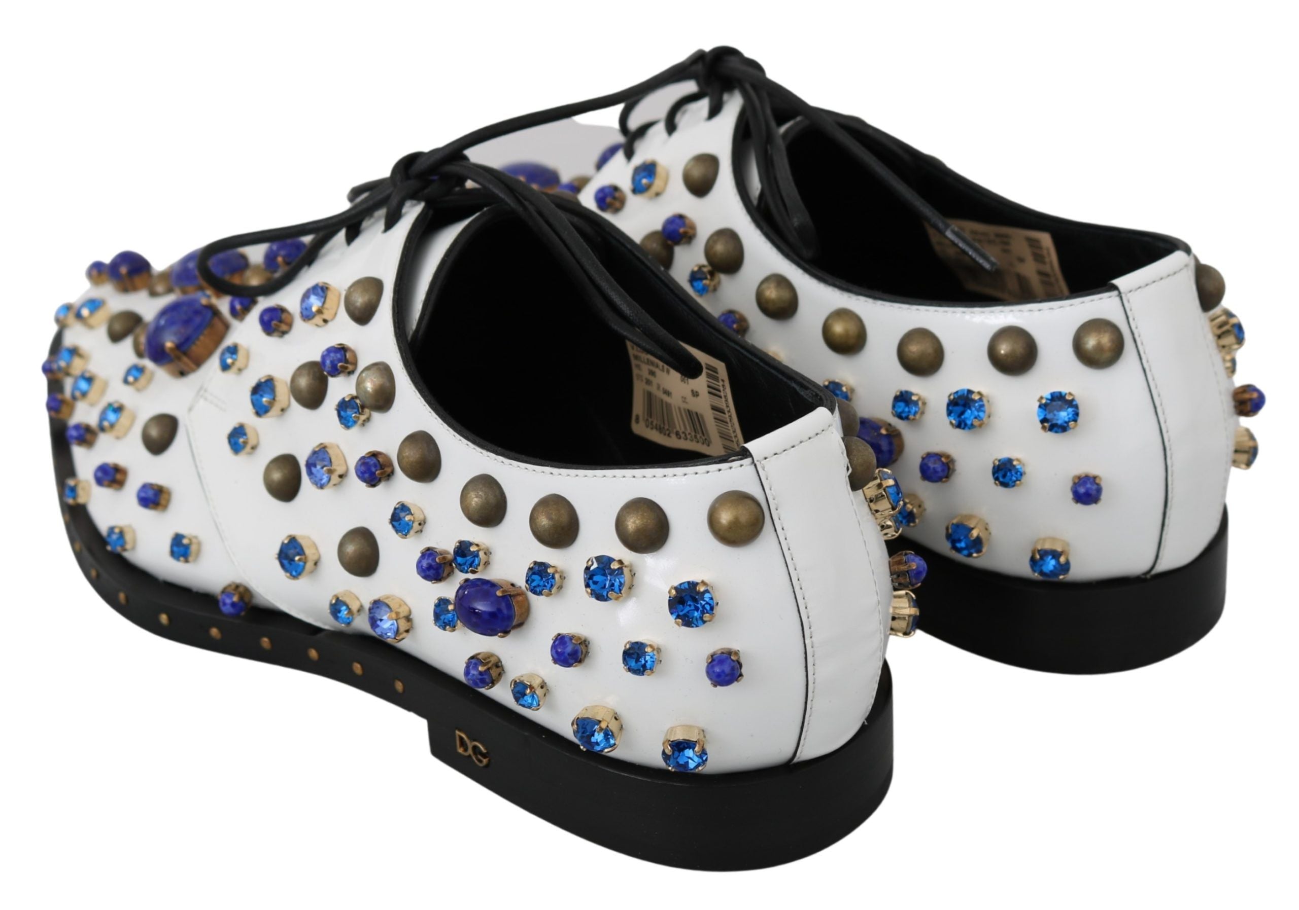 White leather brogue shoes with crystal accents by Dolce & Gabbana, featuring detailed stitching and classic lace-up design.