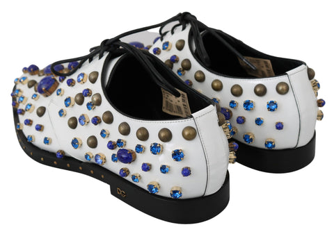 White leather brogue shoes with crystal accents by Dolce & Gabbana, featuring detailed stitching and classic lace-up design.