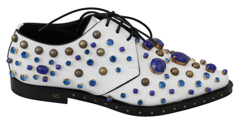 White leather brogue shoes with crystal embellishments by Dolce & Gabbana, featuring detailed stitching and a classic design.