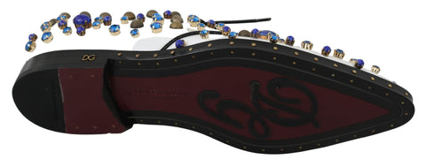 White leather brogue shoes with crystal accents from Dolce & Gabbana featuring detailed stitching and classic design.