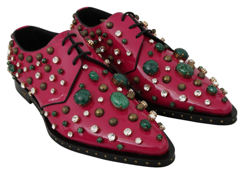 Pink leather brogue shoes with crystal embellishments from Dolce & Gabbana, featuring a classic lace-up design and stylish detailing.