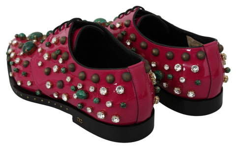 Pink leather brogue shoes with crystal accents by Dolce & Gabbana, featuring a classic lace-up design and elegant detailing.