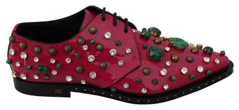 Pink leather brogue shoes with crystal embellishments by Dolce & Gabbana, featuring classic design and decorative detailing.