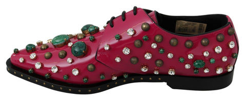 Pink leather brogue shoes with crystal embellishments by Dolce & Gabbana, featuring classic design and stylish detailing.