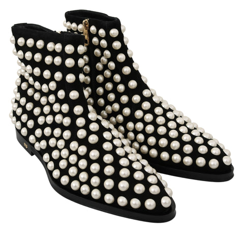 Black suede pearl studded boots by Dolce & Gabbana showing sleek design and decorative pearl accents on the shoes.