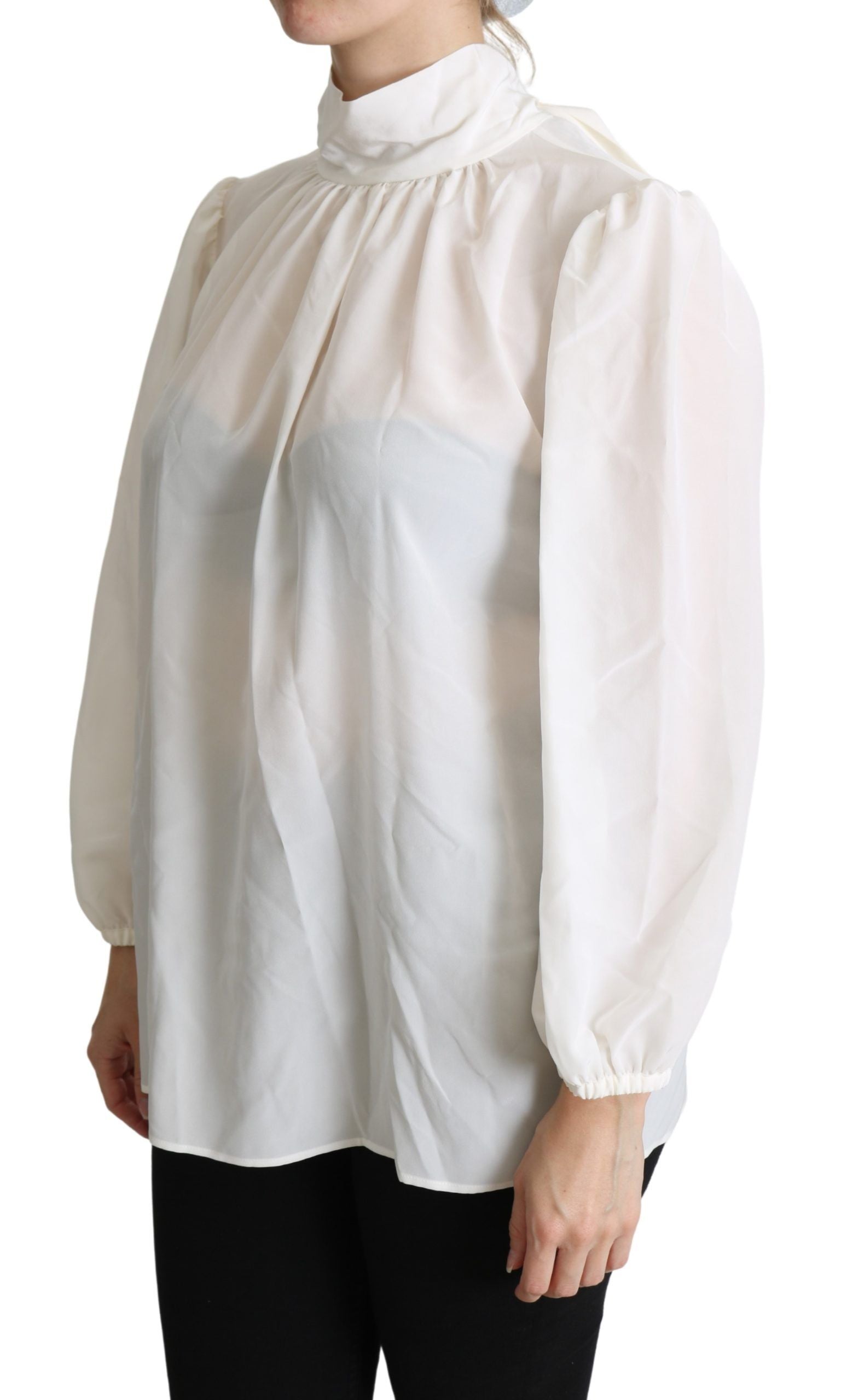 White silk pussy bow long-sleeved blouse by Dolce & Gabbana, featuring a sophisticated collar and elegant long sleeves.