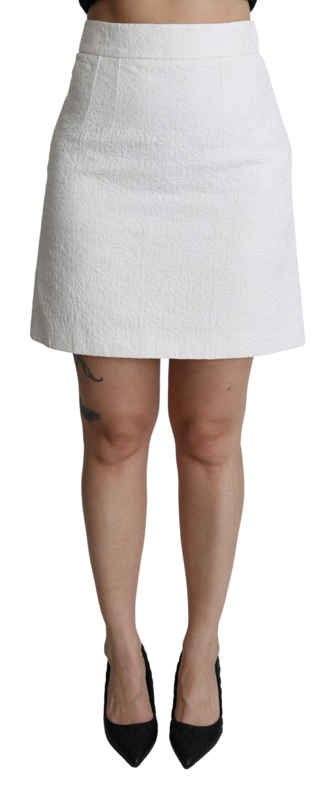 White floral high waist mini brocade skirt by Dolce & Gabbana, shown with intricate floral pattern and elegant high waist design.