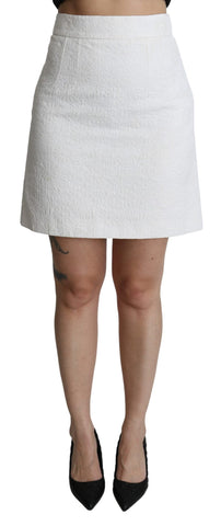 White floral high waist mini brocade skirt by Dolce & Gabbana, shown with intricate floral pattern and elegant high waist design.