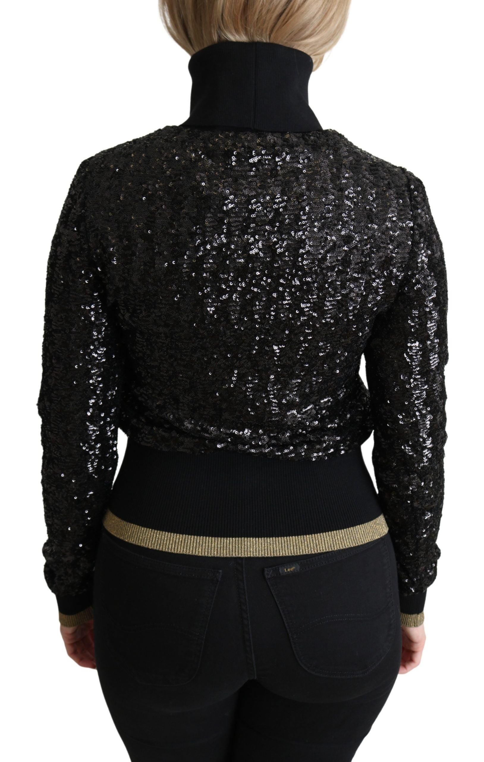 Black sequined knitted turtle neck sweater by Dolce & Gabbana, featuring a close-up of the sparkling, textured fabric.