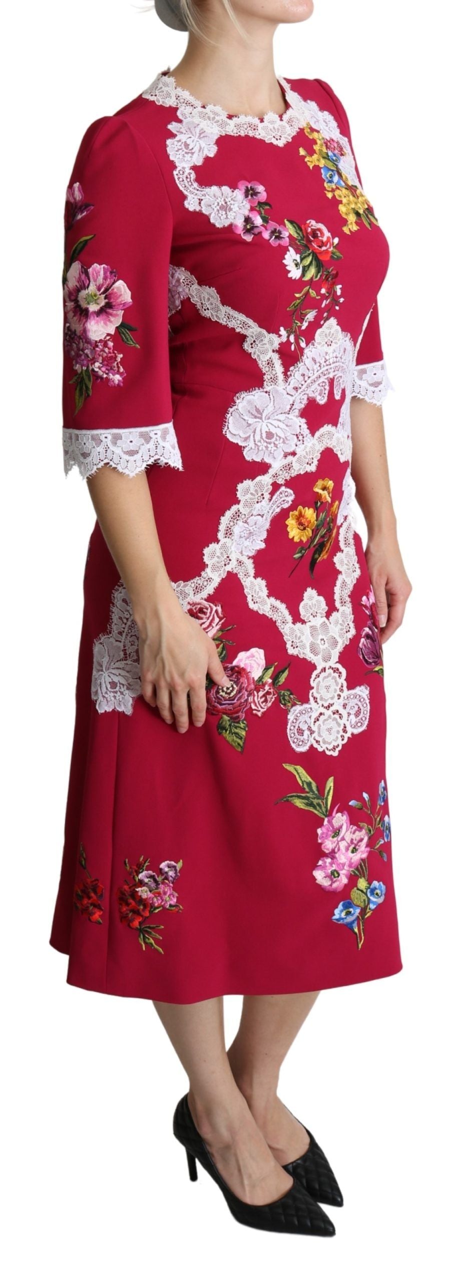 Red floral embroidered sheath midi dress by Dolce & Gabbana displayed on a hanger, showcasing detailed embroidery and elegant design.