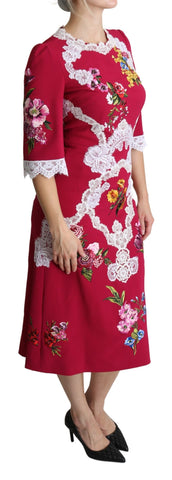 Red floral embroidered sheath midi dress by Dolce & Gabbana displayed on a hanger, showcasing detailed embroidery and elegant design.