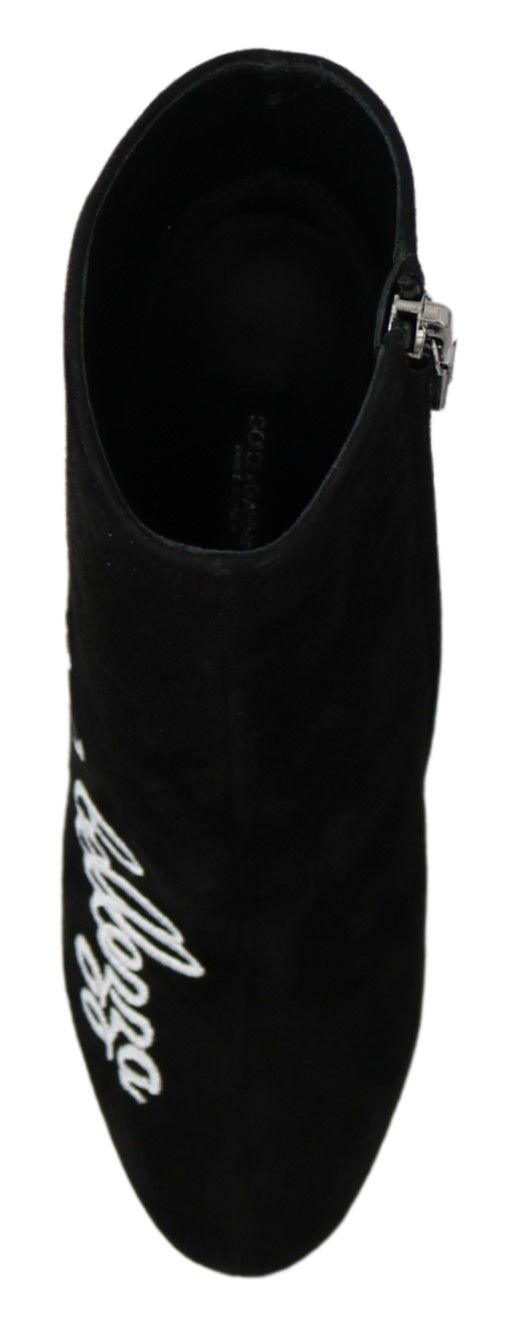 Black suede L'Amore E'Bellezza boots by Dolce & Gabbana with sleek design and pointed toes, displayed on a neutral background.