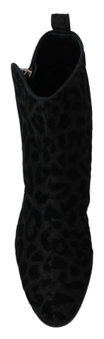 Black leopard print short boots with zipper closure by Dolce & Gabbana, showcasing stylish footwear with animal print design.