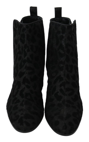 Black leopard print Dolce & Gabbana short boots with zipper detail, showcasing stylish footwear with bold animal print design.