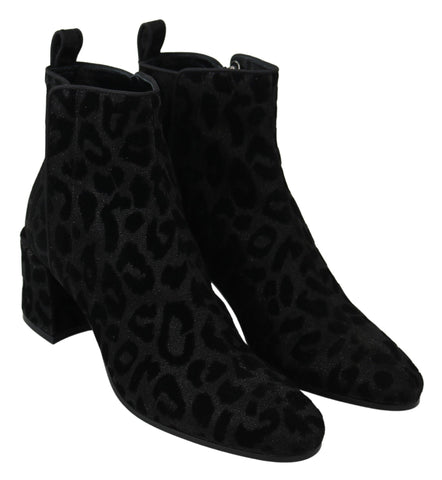 Black leopard print Dolce & Gabbana short boots with zipper closure, stylish and trendy footwear.