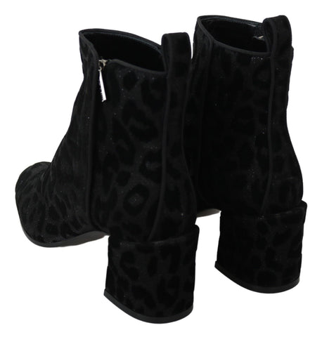 Black leopard print short boots with zipper detail from Dolce & Gabbana, showcasing stylish footwear with bold animal print design.