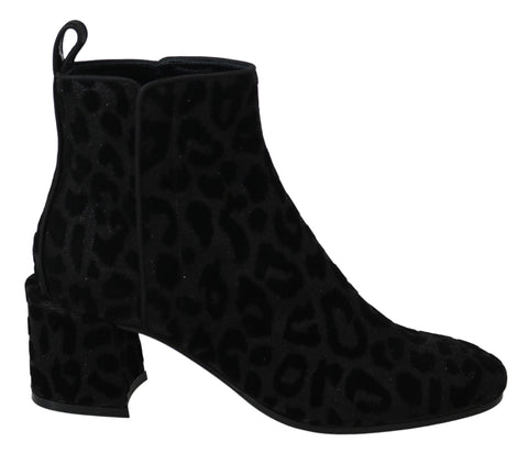 Black leopard print short boots with zipper closure from Dolce & Gabbana, stylish footwear with bold animal pattern.