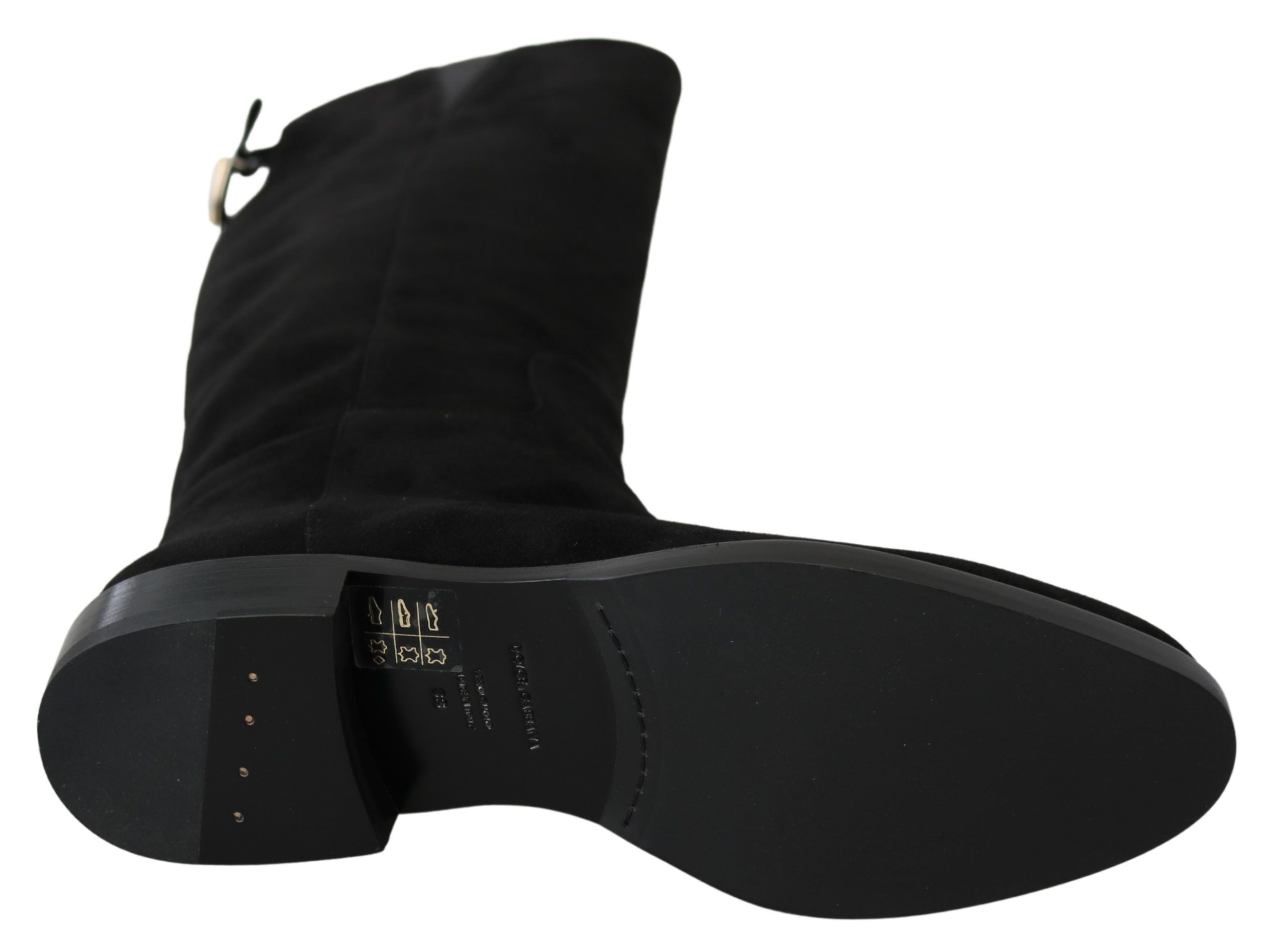 Black suede knee-high flat boots from Dolce & Gabbana, featuring sleek design and pointed toes.