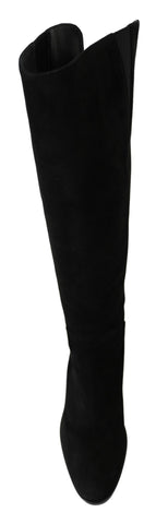 Black suede knee-high flat boots by Dolce & Gabbana, featuring sleek design and smooth texture for elegant style.