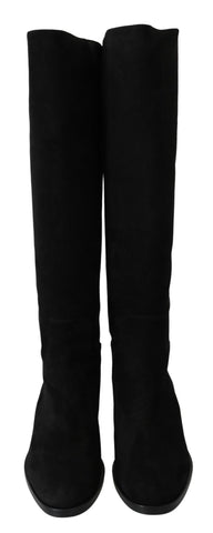 Black suede knee-high flat boots from Dolce & Gabbana with a sleek, smooth finish and classic design.