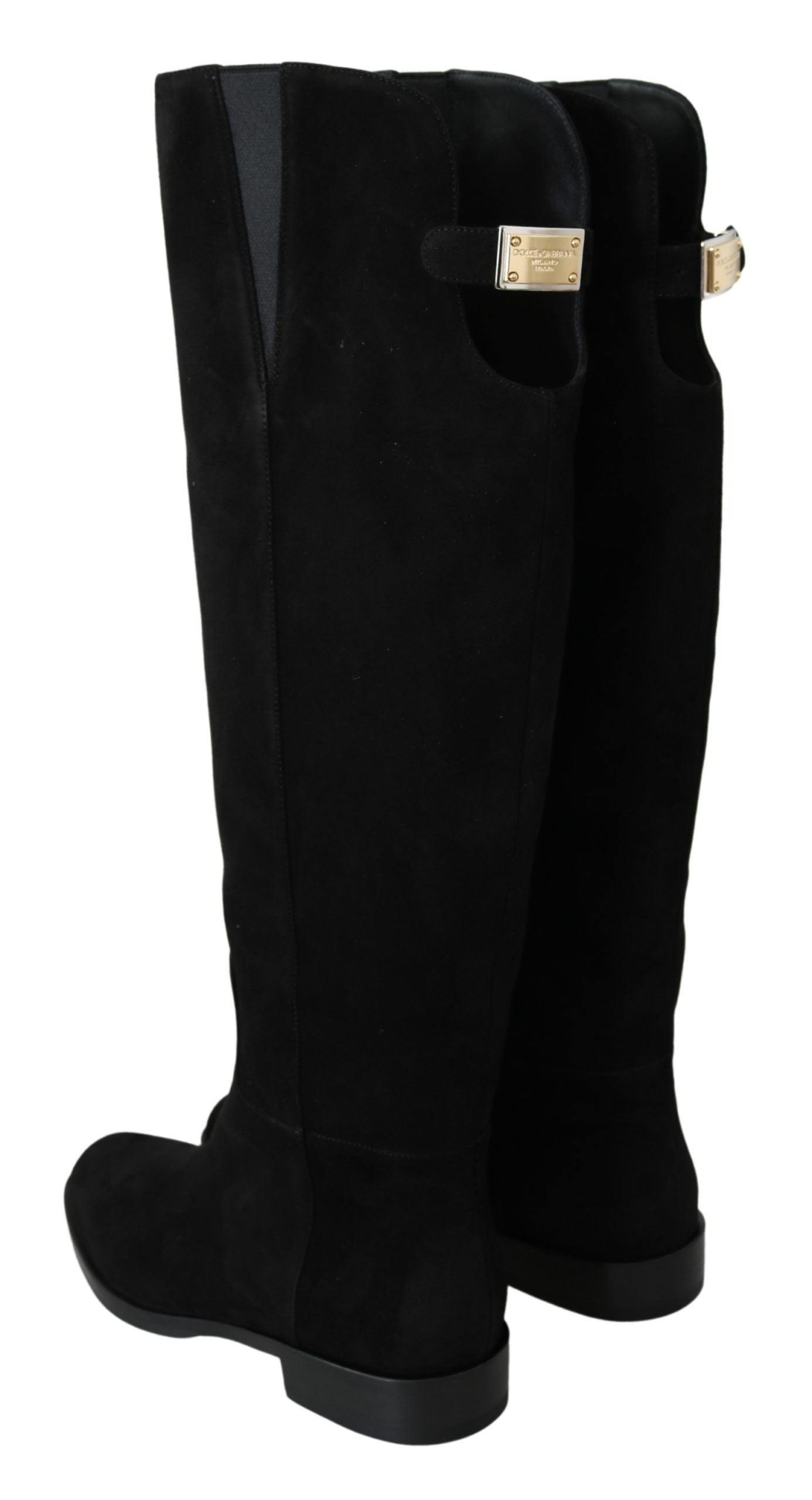 Black suede knee-high flat boots by Dolce & Gabbana, featuring sleek design and pointed toes.