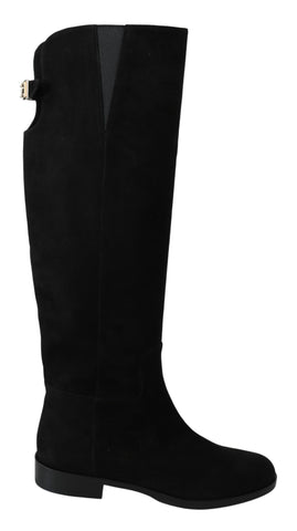 Black suede knee-high flat boots by Dolce & Gabbana, showing smooth suede texture and sleek knee-length design.