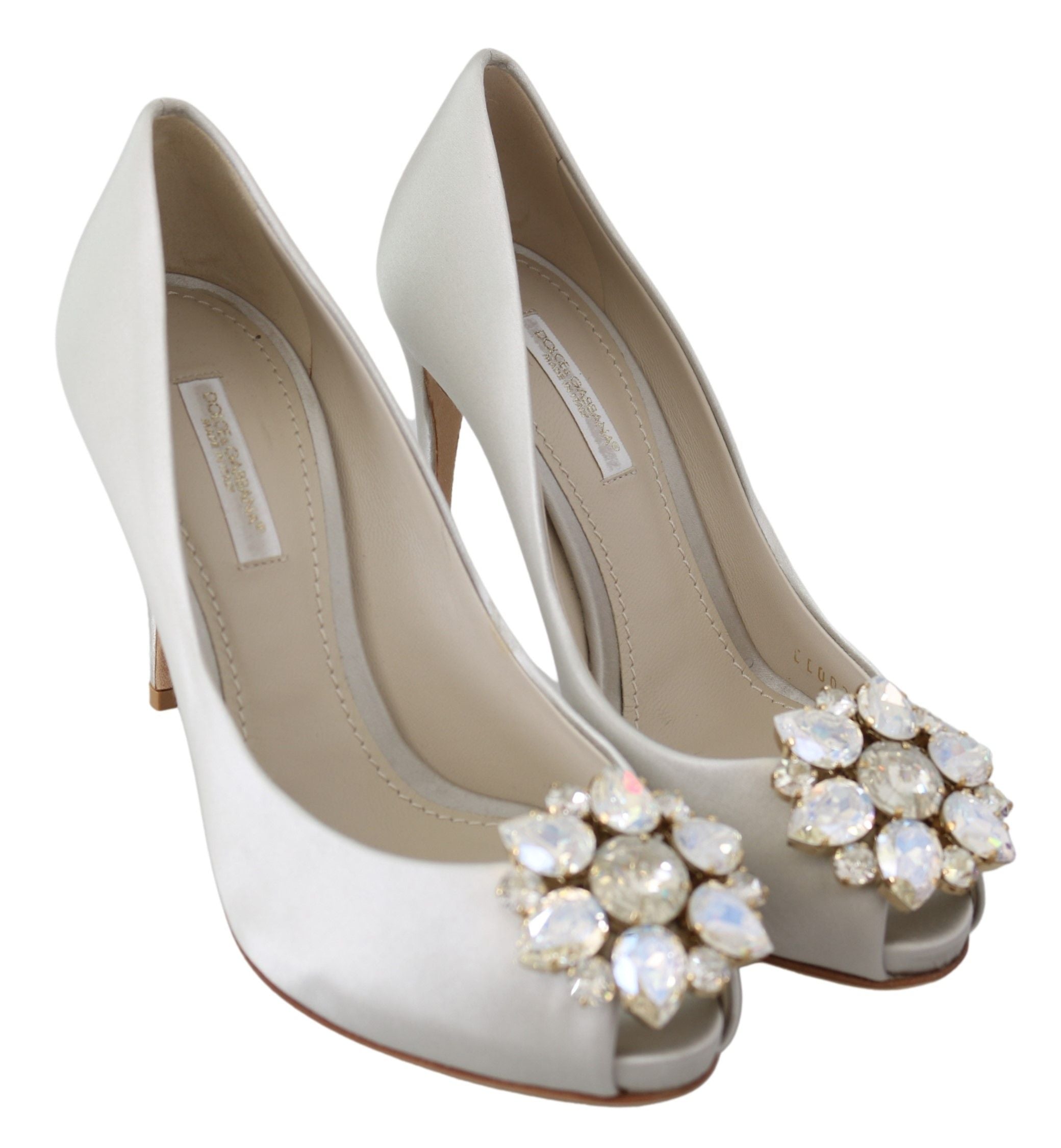 Dolce & Gabbana white satin peep toe heels with crystal embellishments, elegant pump shoes with a stylish open toe design.