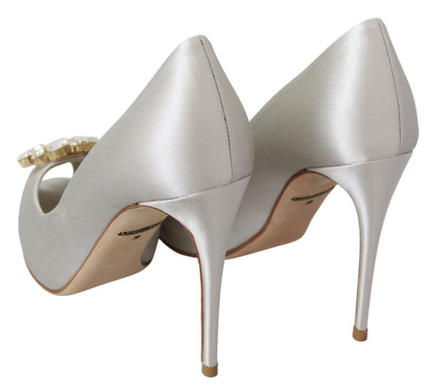 White satin peep toe heels by Dolce & Gabbana with crystal embellishments, elegant pumps perfect for formal occasions.