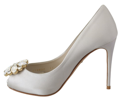 White satin peep toe heels by Dolce & Gabbana with crystal embellishments, stylish pumps for elegant occasions.
