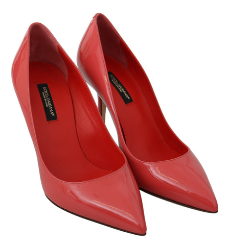 Dark pink patent leather Dolce & Gabbana heels pumps with pointed toes and stiletto heels, showcasing a stylish and elegant design.
