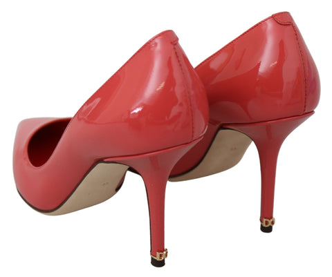 Dark pink patent leather Dolce & Gabbana heels pumps with pointed toes and stiletto heels, stylish and elegant footwear.