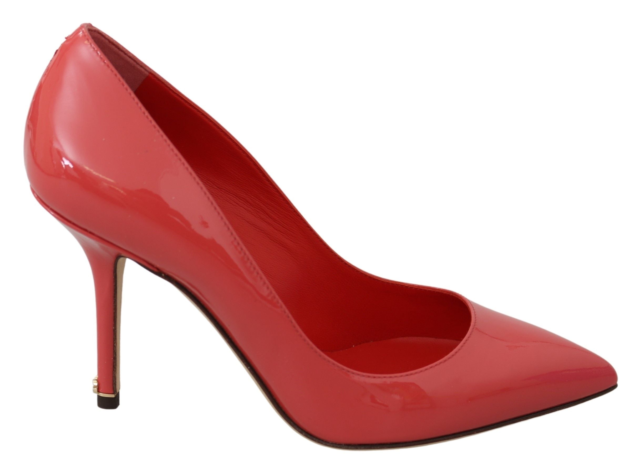 Dark pink patent leather Dolce & Gabbana heels pumps with pointed toe and stiletto heel, stylish and glossy fashion footwear.